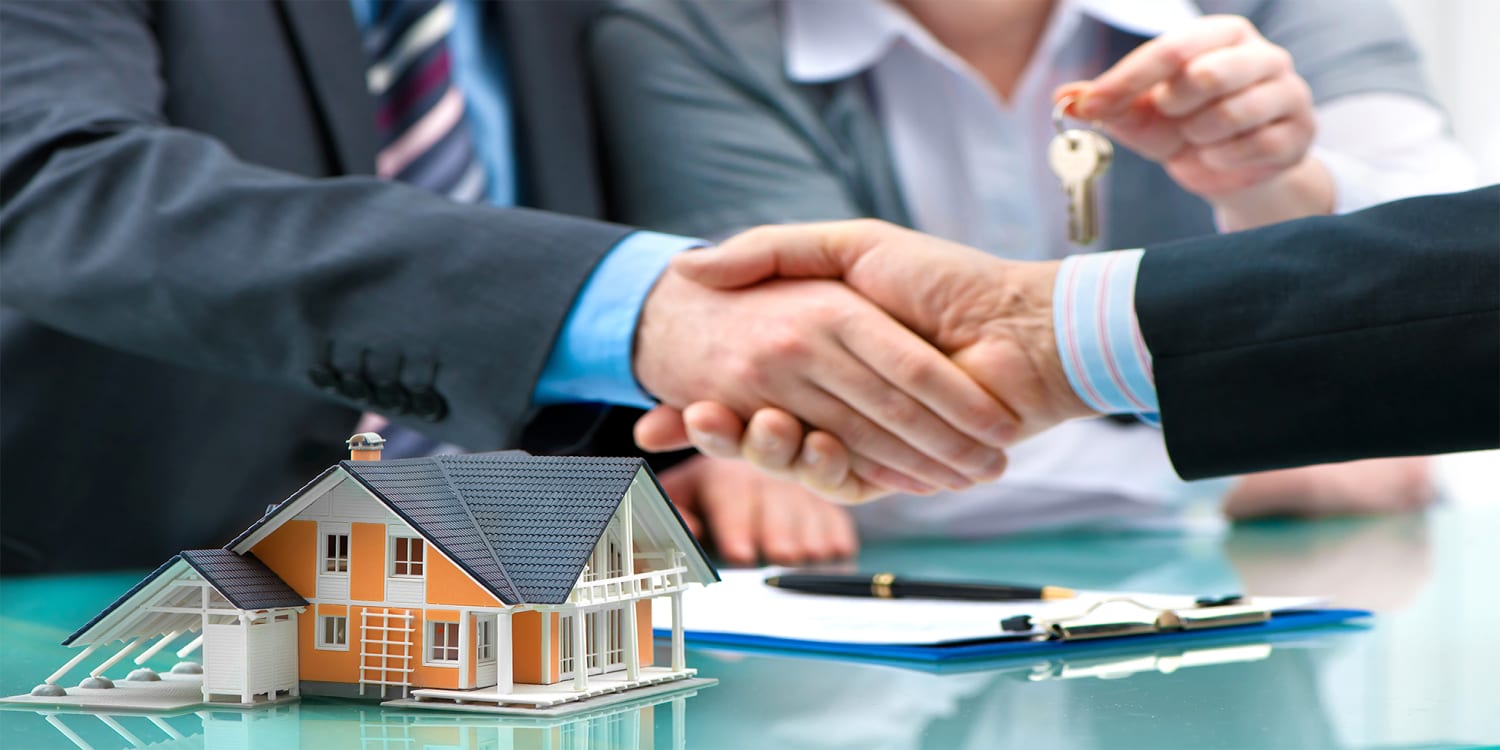 Clients and investor completing a cash home sale.